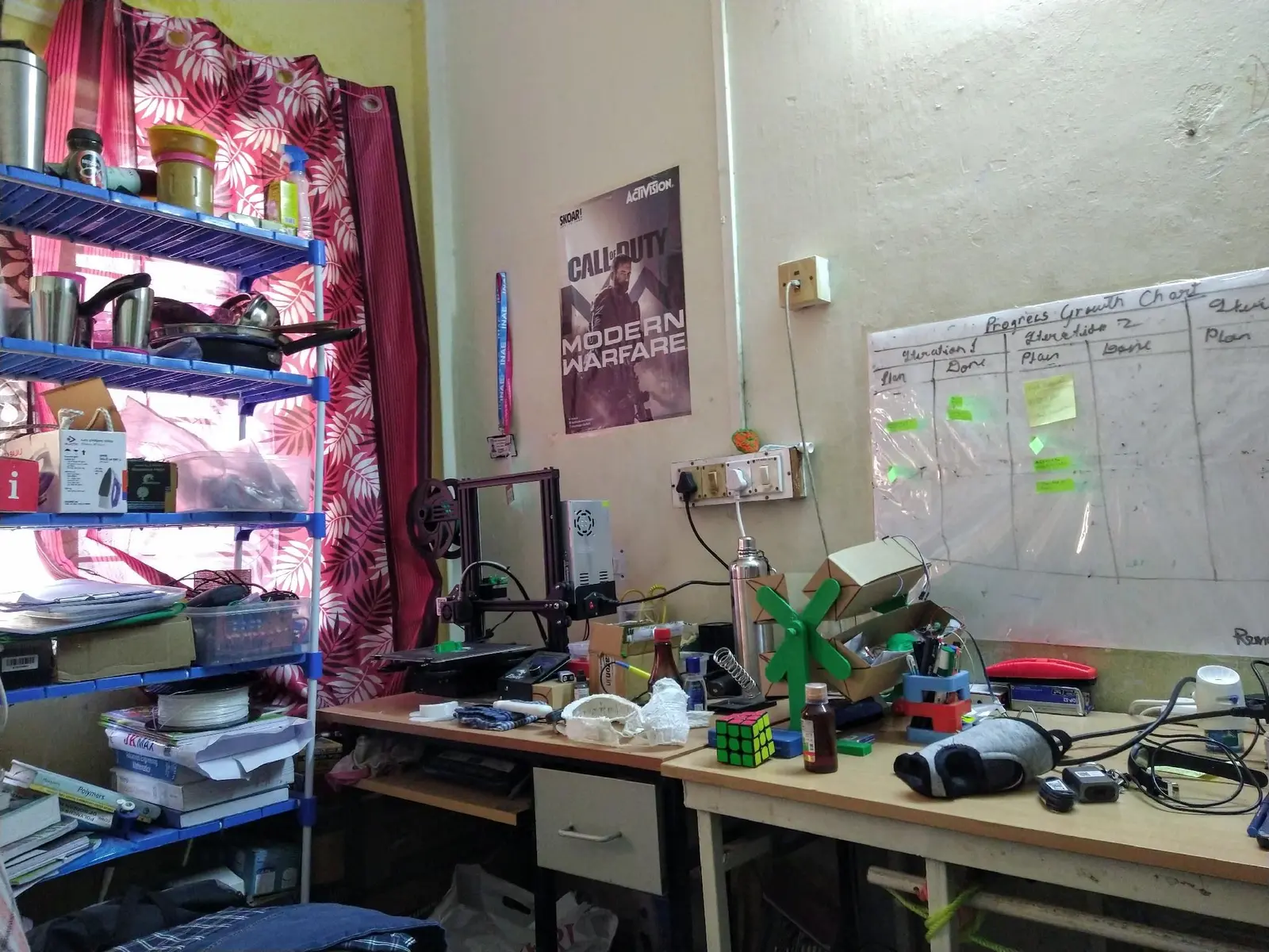 The hostel-room lab at IIT Kharagpur: one printer, a growth chart on the whiteboard, and most of a Master’s worth of side projects.