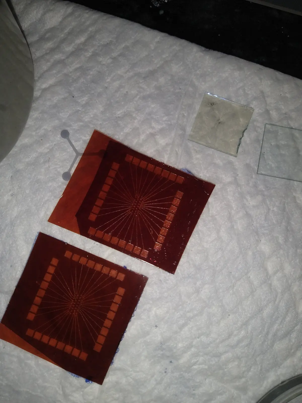 The first mask for the wearable patch sensor, cut and aligned by hand.
