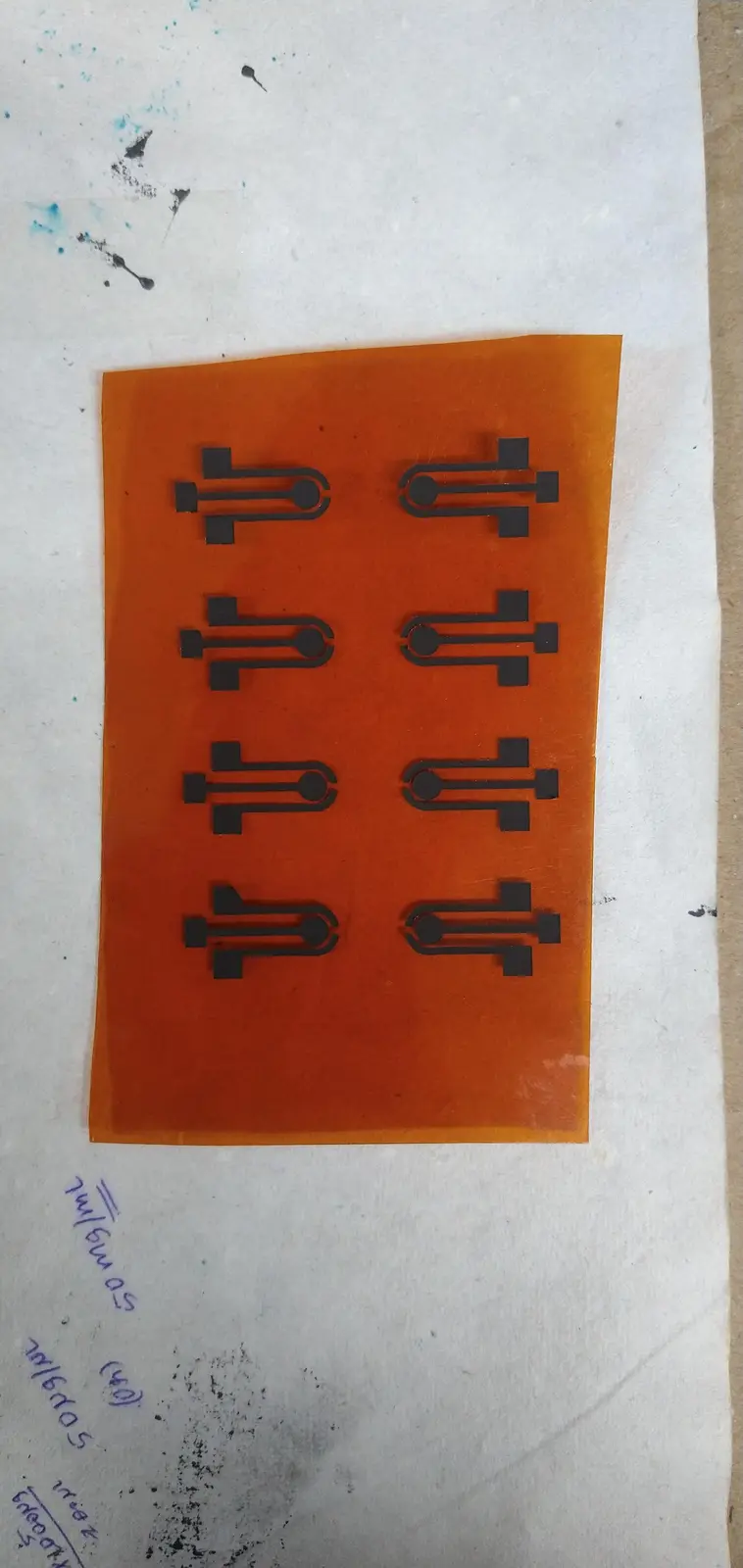 Eight three-electrode cells screen-printed onto Kapton in one pass — my own fabrication process, no cleanroom involved.